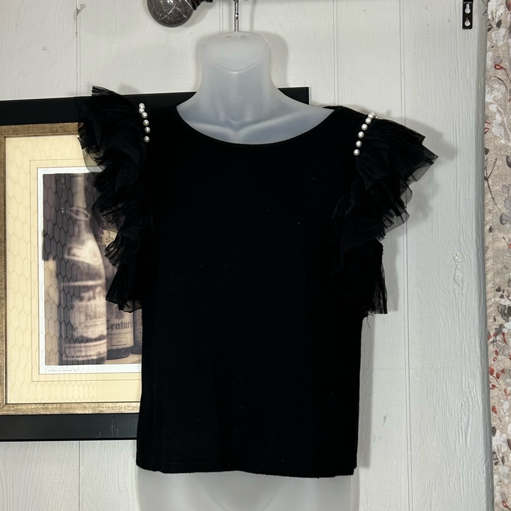 Black Top with Ruffle short sleeve and pearl embellishments at the shoulder